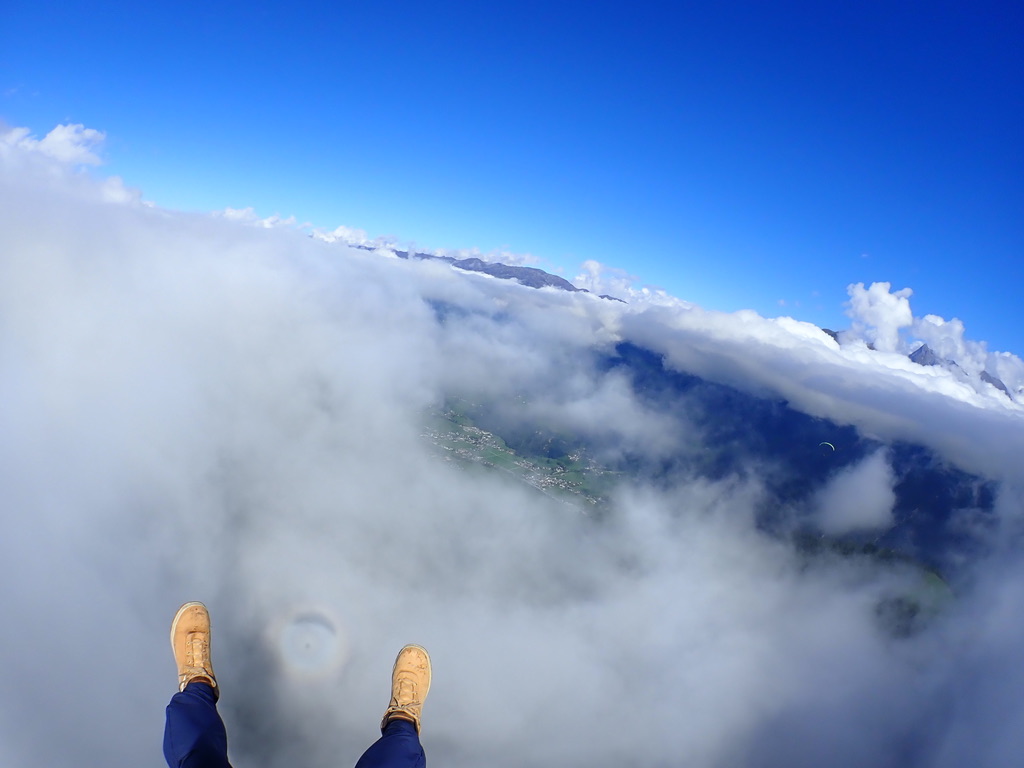 Tandem- Paragliding above the clouds